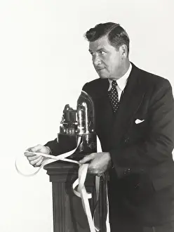 Broker: Man reading stock ticker