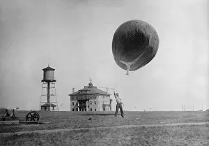 Lighter Than Air: Man about to release a Weather Bureau balloon, c
