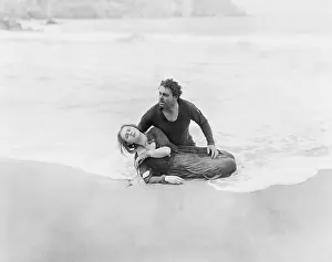 Rescuer: Man rescuing woman from ocean