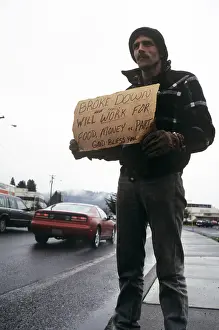 Car005: Man On Roadside Holding Sign Requesting Work