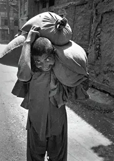 Toil: Man with sack, Kashmir
