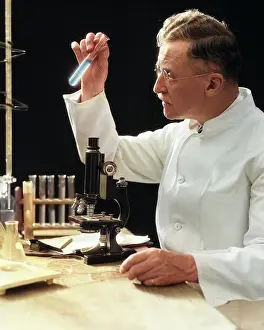 Manly: Man Scientist Lab Technician in White Coat Looking
