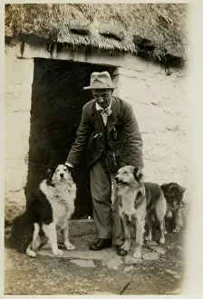 Croft: Man in Scotland with three collie dogs