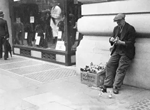 Clockwork: Man selling clockwork toys on street