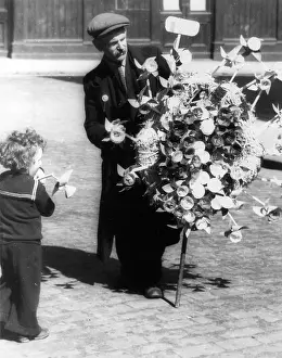 Windmills: Man selling toy windmills