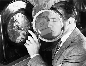 Timing: Man setting a clock