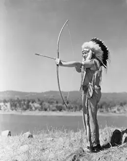 Minorities: Man shooting with bow and arrow