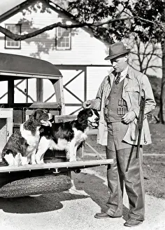 Bodied: Man with Shotgun under his Arm and Springer Spaniel Dogs