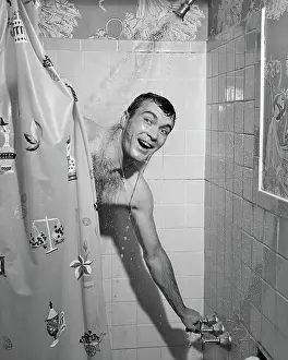 Man in Shower Turning on Water and Pulling Shower Curta