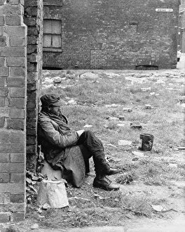 Cleared: Man sitting in cleared area - Manchester 1965