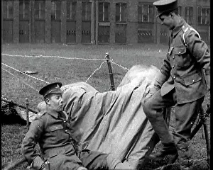 Collapsing: A Man Sitting On Top of a Cloth Covering A