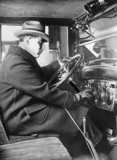 Motorcar: Man sitting inside of a Chevrolet Sedan, 1925