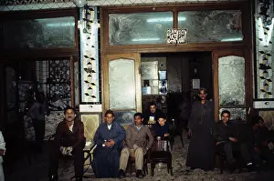 1987egypt: Man sitting outside a coffee house that ?