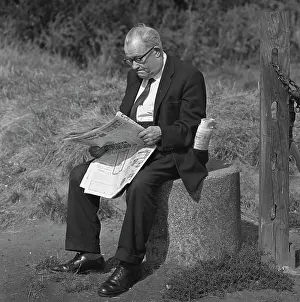 Tony Boxallfrps: Man sitting reading a newspaper