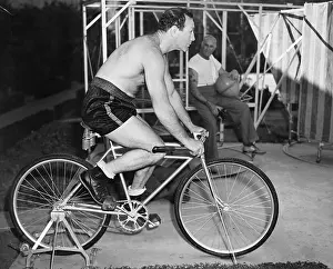 Workouts: Man sitting on a stationary bicycle doing exercise