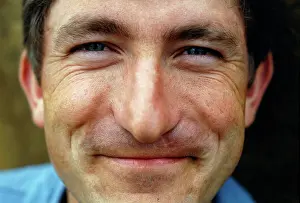 Oosterbroek: Man smiling close up and directly into the camera