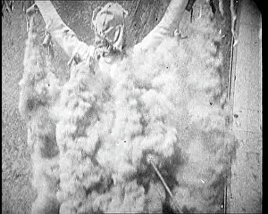 Cannisters: A Man With Smoke Cannisters Pouring Out From