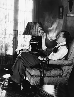 Addicts: Man smoking in living room
