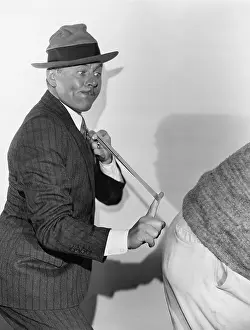 Focused: Man snapping rear end with rubber band