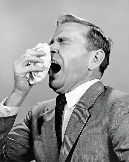 Cough: Man Sneezing Into Handkerchief