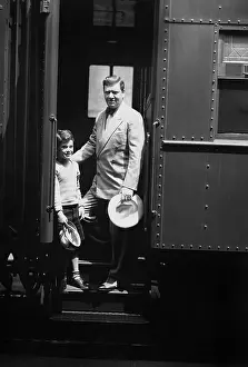Farewells: Man and son on train
