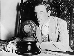 Waist Up: Man speaking into a microphone