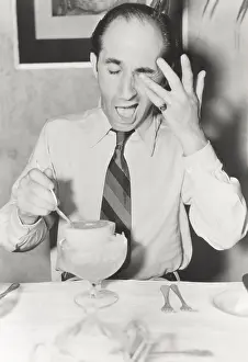 Irritated: Man squirted by grapefruit