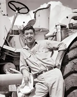 Mover: Man Standing Beside Large Piece Heavy Construction