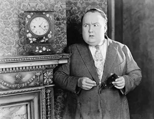 Mantles: Man standing in a living room