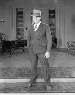 Seriousness: Man standing in an office