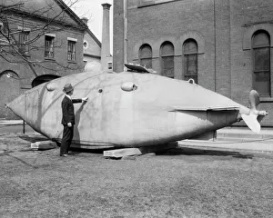 Oddity: Man Standing Next to Old Submarine from 1864 The