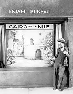 Lamenting: Man standing in front of a store