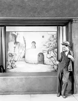 Lamenting: Man standing in front of a store