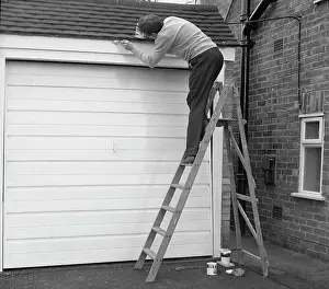 Tony Boxallfrps: Man up a step ladder, painting his garage