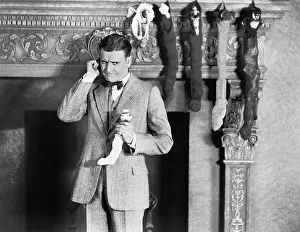 Generosity: Man with stockings over fireplace
