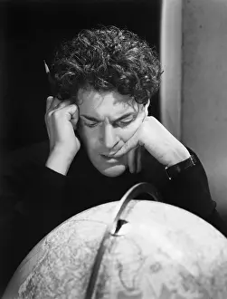 Pencils: Man studying the globe