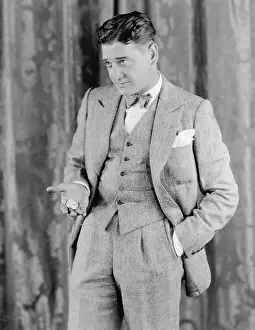 Timepiece: Man in a suit holding his pocket watch