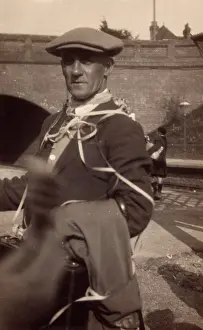 Streamer: Man with suitcase at a railway station