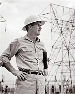 Lineman: Man Supervisor Wearing Work Clothes Hard Hat Holding