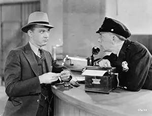 Fedora: Man with surprised policeman