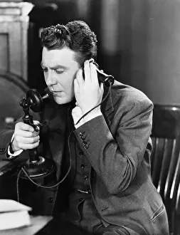 Absorb: Man talking on telephone
