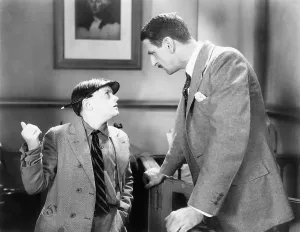 Advising: Man talking to a young boy reporter