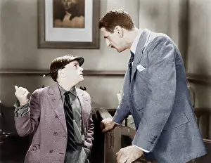Advising: Man talking to a young boy reporter
