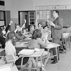 Grades: Man Teacher Asking Class a Question Four Students