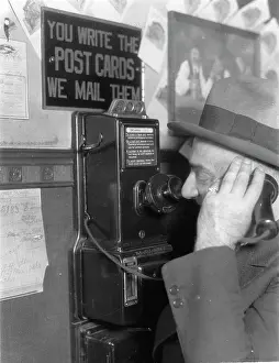 Telephoned: A man telephoned in a Brauhaus. About