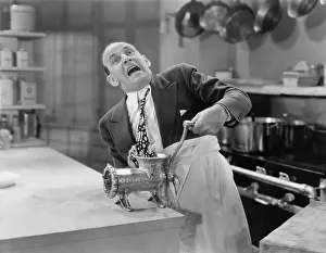Scream: Man with tie stuck in meat grinder