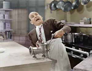 Scream: Man with tie stuck in meat grinder