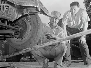 Bending: A man has tires checked and adjusted to prevent