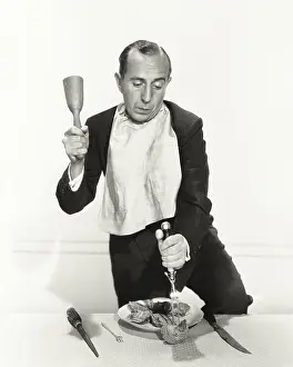 Cracking: Man trying to crack open oyster shell