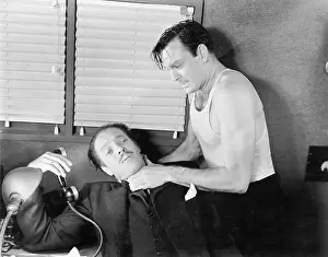 Strangling: Man trying to kill man in his office